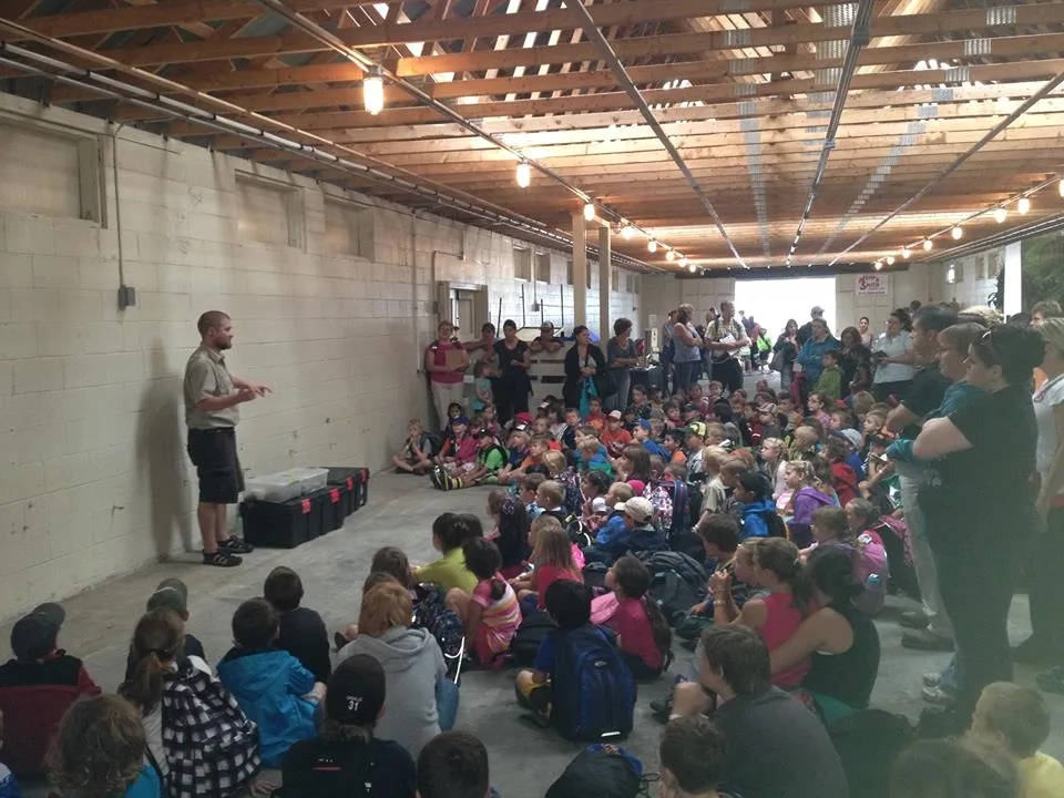 Large school presentation with students watching