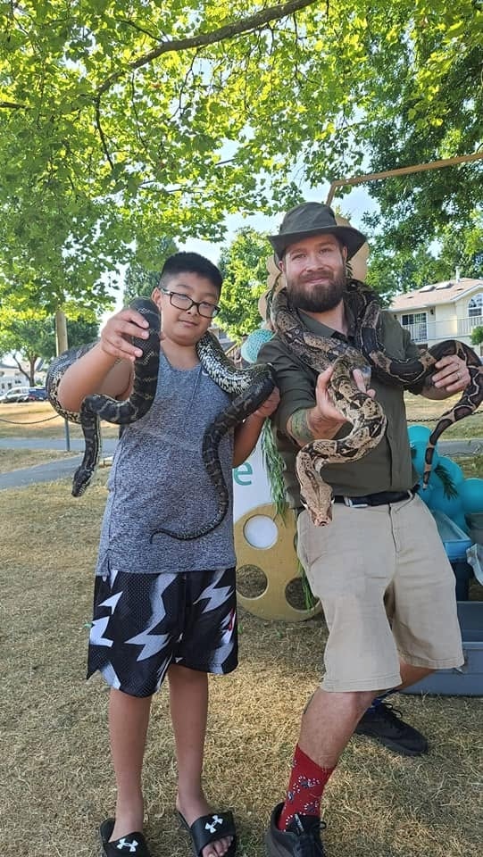 Kevin with a participant and a snake